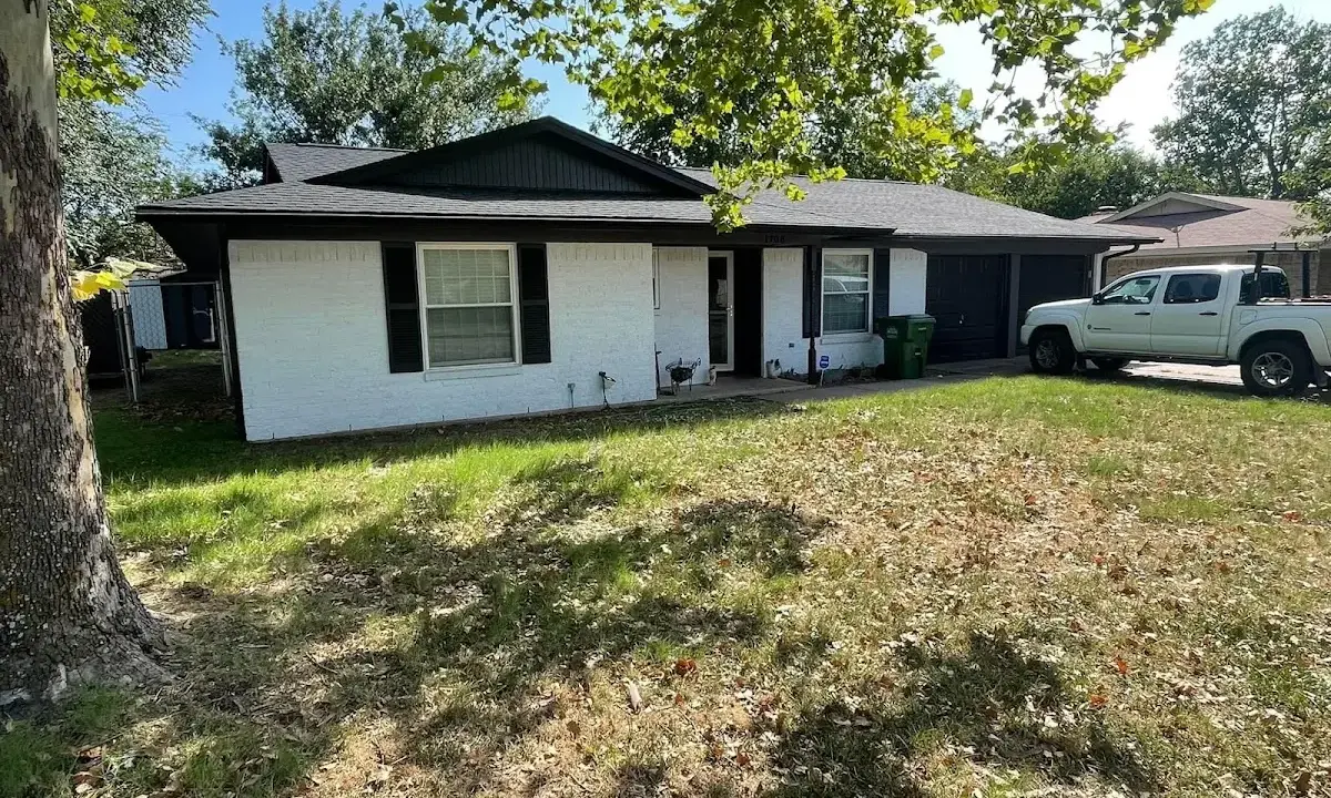 Professional roofing crew working on a residential roof in Cincinnati